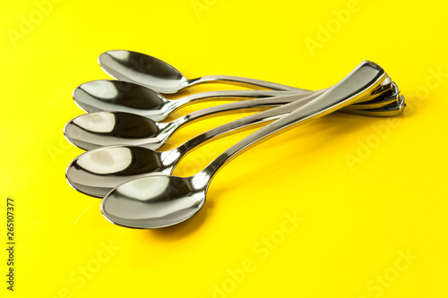 spoons on yellow