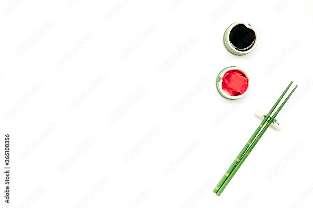 bamboo sticks, soy sauce, ginger for sushi and maki on white background top view mockup bamboo sticks, soy sauce, ginger for sushi and maki on white background top view mockup
