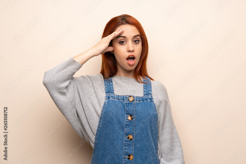 Young redhead woman over isolated background has just realized something and has intending the solution Young redhead woman over isolated background has just realized something and has intending the solution
