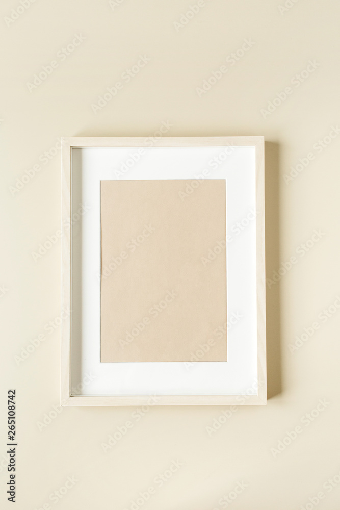 Minimal photo frame on beige wall. Modern interior design concept. Blank copy space mock up. Minimal photo frame on beige wall. Modern interior design concept. Blank copy space mock up.