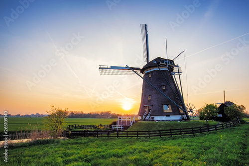 Sunset on Windmills in Stompwijk, Netherlands.