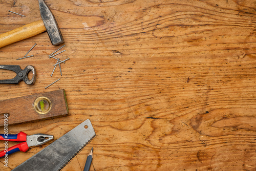 Woodworking tools on a wooden background with copy space