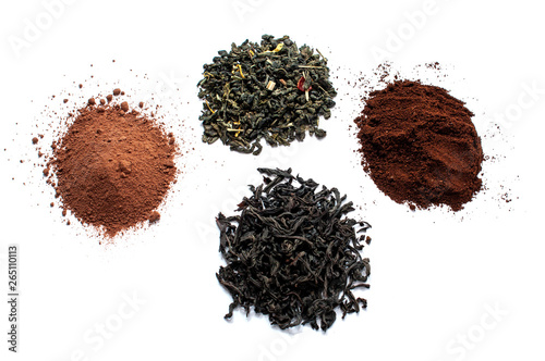 Black and green dry tea leaves, cocoa and ground coffee isolated on white background. View from above