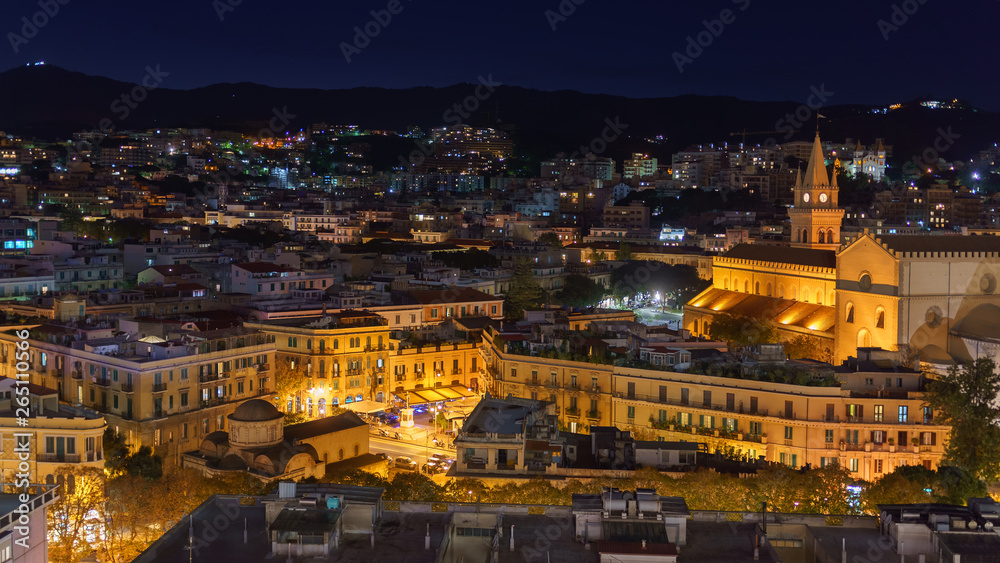 MESSINA, ITALY - NOVEMBER 06, 2018 - Panoramic top night view of the local buildings with lights, mountains in the beautiful city of Sicily