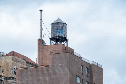 Photography typical water tank on the roof of a building in New York City