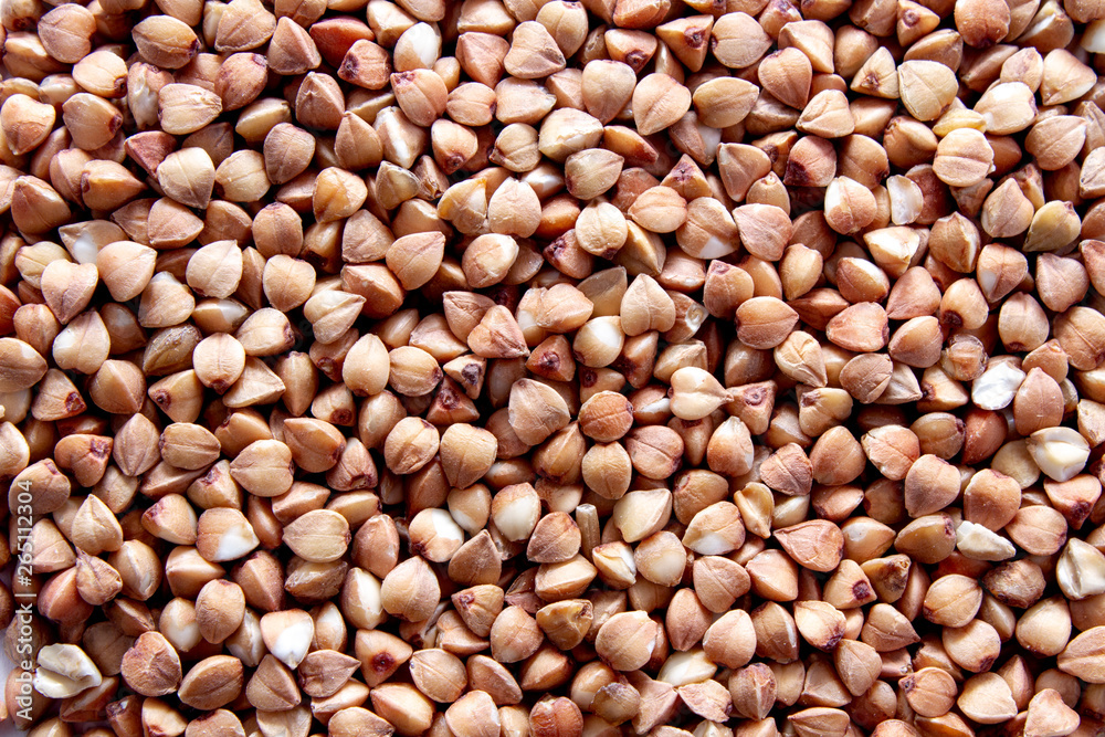 Buckwheat groats isolated on white background. Close-up Buckwheat groats isolated on white background. Close-up