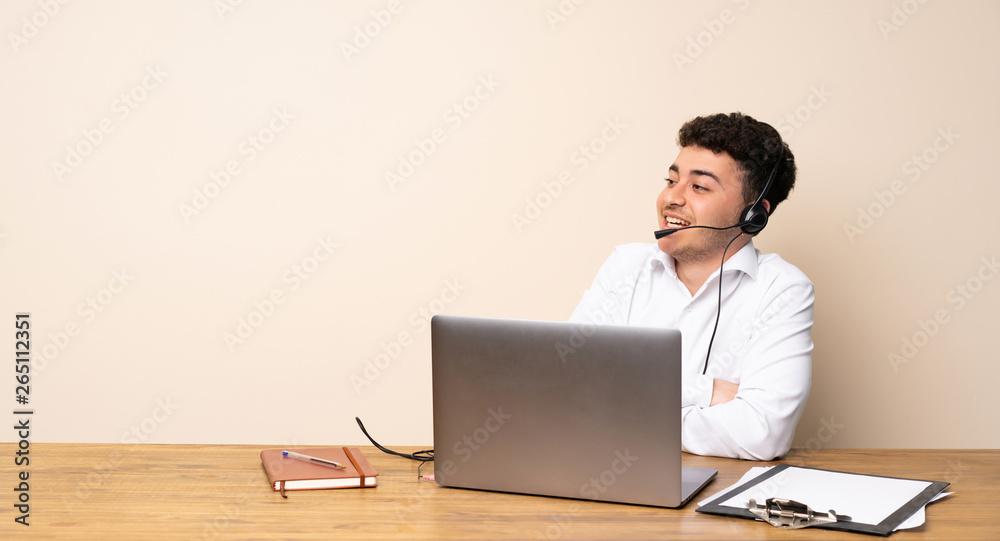 Telemarketer man looking up while smiling Telemarketer man looking up while smiling