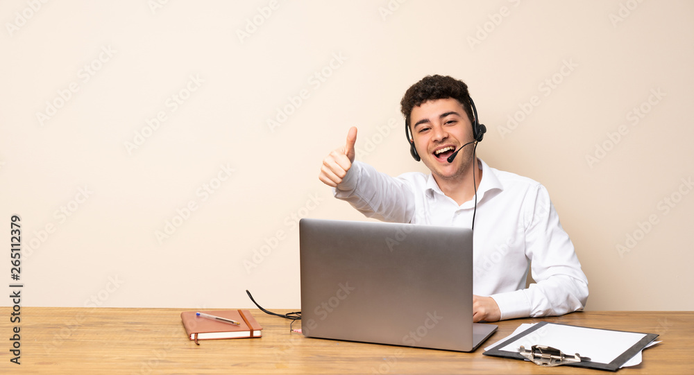 Telemarketer man with thumbs up because something good has happened Telemarketer man with thumbs up because something good has happened