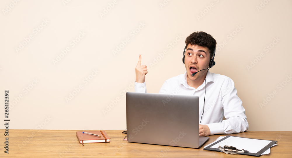 Telemarketer man intending to realizes the solution while lifting a finger up Telemarketer man intending to realizes the solution while lifting a finger up