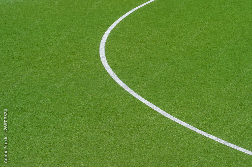 Obraz premium Artificial green turf texture background with white line marks