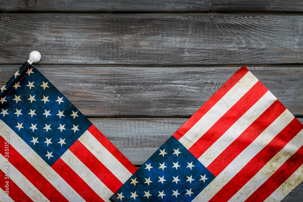 Obraz premium Independence day of USA with flag on gray wooden background top view space for text
