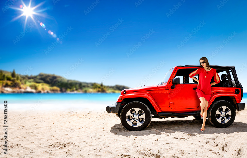 Slim young woman in summer dress and red car on beach. Free space for your decoration. 