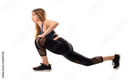 Blonde Sport Woman over isolated white background and stretching