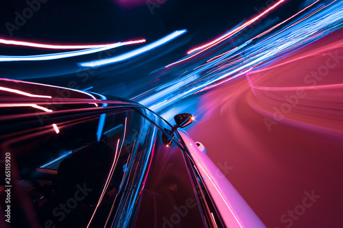 POV of car driving at night city with motion blur