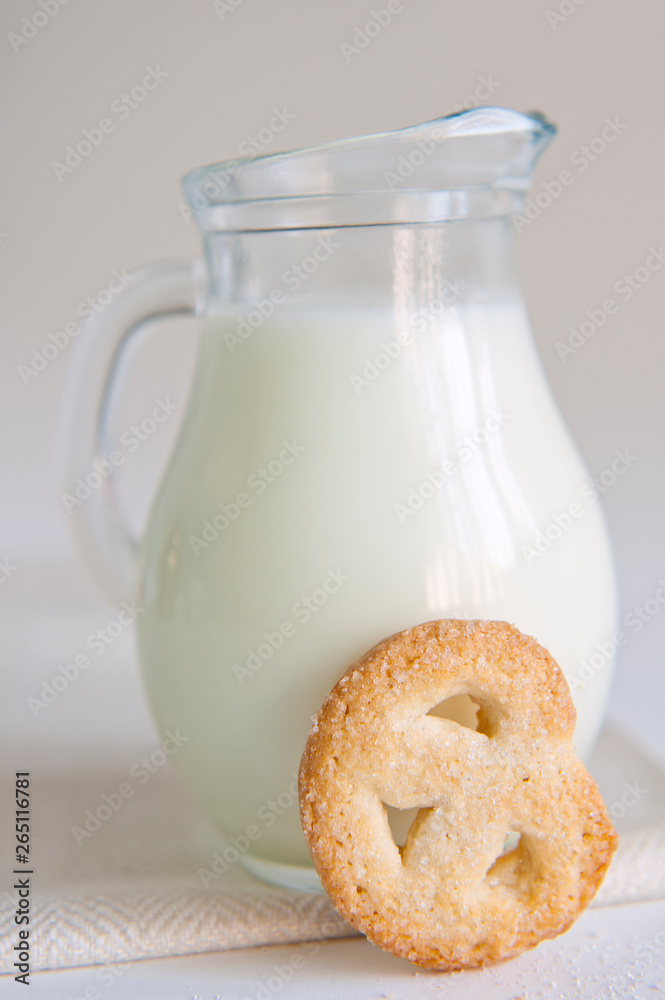Milk and cookies on the white background Milk and cookies on the white background