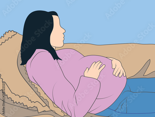 Pregnant woman lying on her back holding belly - baby inside