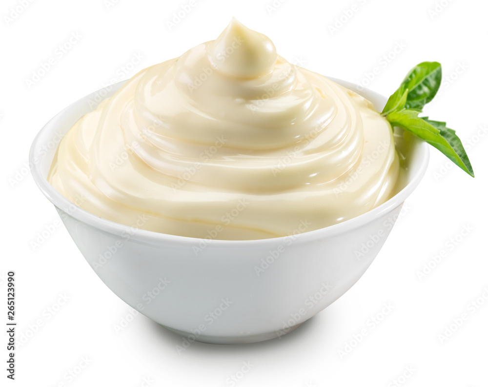 Mayonnaise swirl in white bowl. Clipping path. Mayonnaise swirl in white bowl. Clipping path.