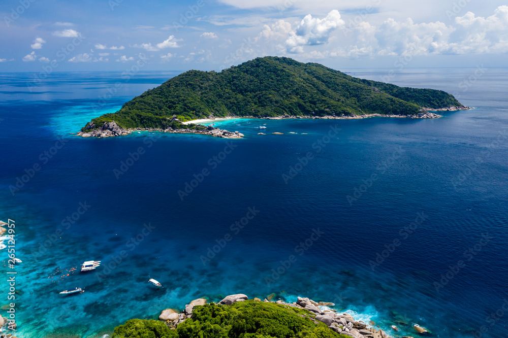 Aerial drone view of diving and snorkel boats around the beautiful tropical Similan Islands in Thailand