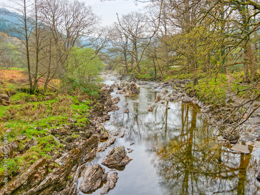 The rock strewn River Mawddach in Gwynedd on a hazy spring day in Cymru. The rock strewn River Mawddach in Gwynedd on a hazy spring day in Cymru.