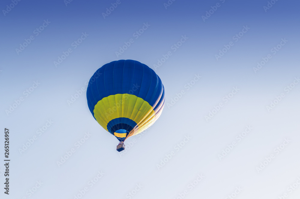 Colorful hot air balloon flying in the blue sky Colorful hot air balloon flying in the blue sky