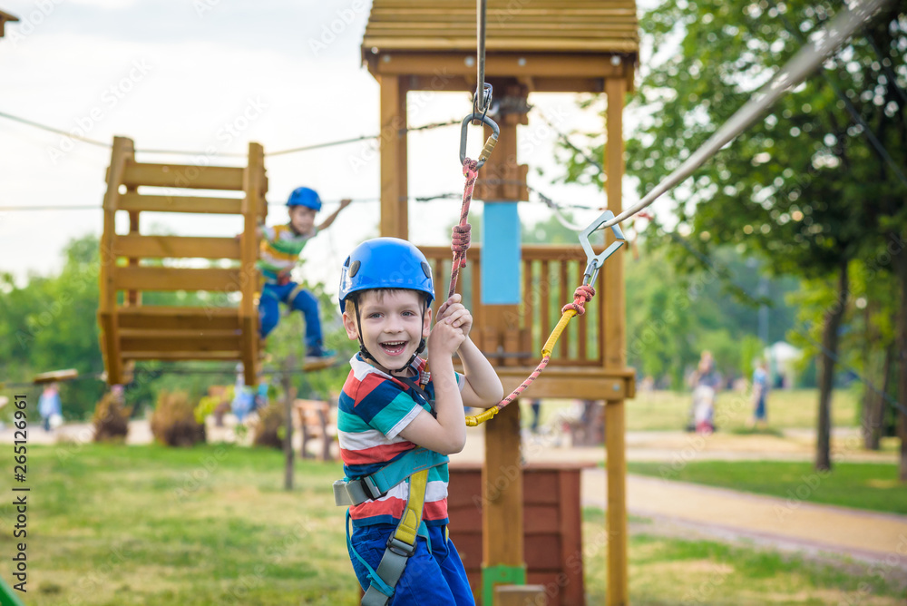Young boy playing and having fun doing activities outdoors. Happiness and happy childhood concept Young boy playing and having fun doing activities outdoors. Happiness and happy childhood concept