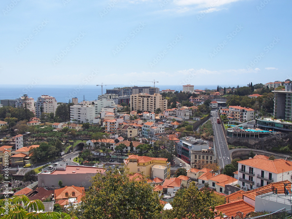 an aerial view of funchal in in madeira with roads running thought the center of the city and buildings in front of the sea