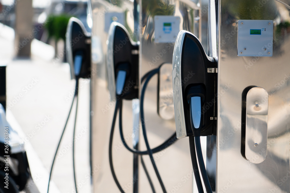 Electric car charging station in luxury marina by the sea