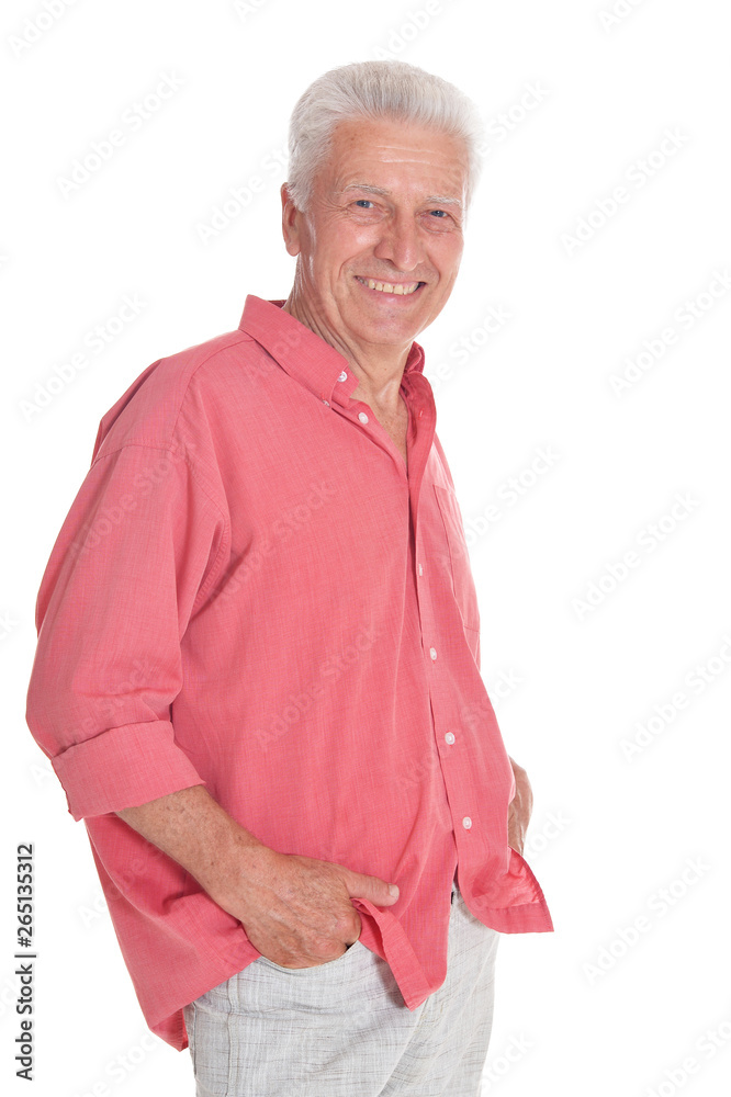 Smiling senior man holding hands in pockets posing on white background Smiling senior man holding hands in pockets posing on white background