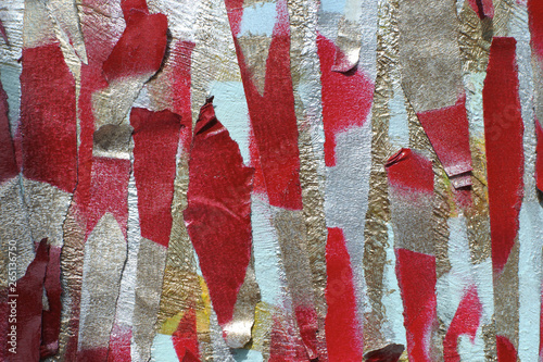 pieces of cut colored paper. the adhesive tape is painted in several layers. background of complex color texture