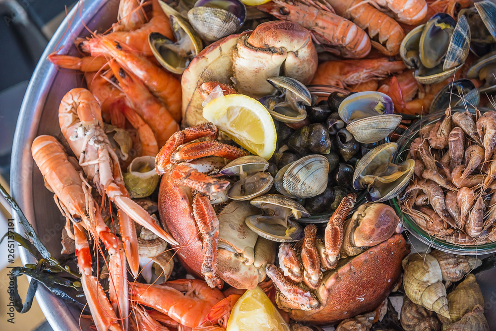 Delicious seafood plate: crab, shrimp, norway lobsters Delicious seafood plate: crab, shrimp, norway lobsters
