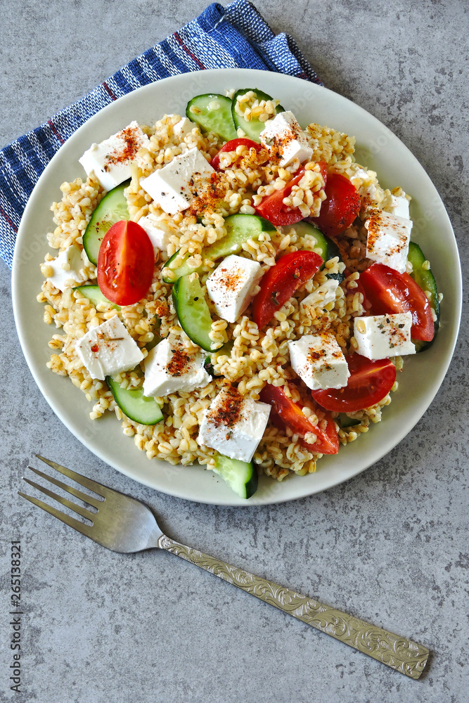 Healthy salad with bulgur, vegetables and feta. Middle Eastern style. Healthy salad with bulgur, vegetables and feta. Middle Eastern style.