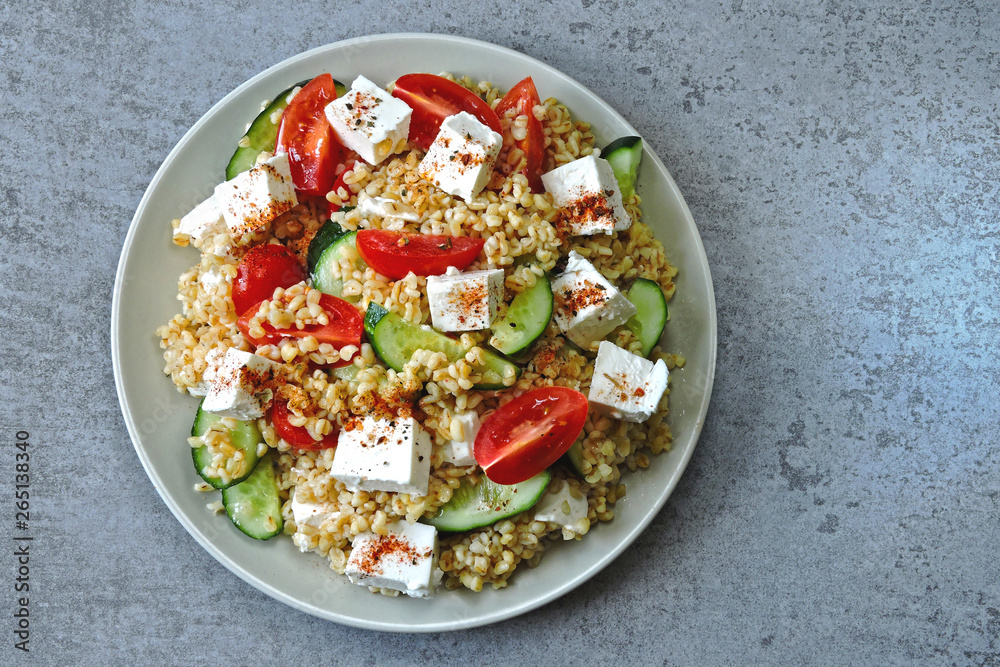 Healthy salad with bulgur, vegetables and feta. Middle Eastern style. Healthy salad with bulgur, vegetables and feta. Middle Eastern style.