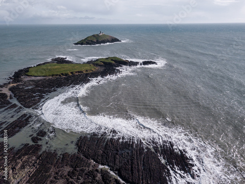 Black lighthouse off the coast of the small irish village called Ballycotton