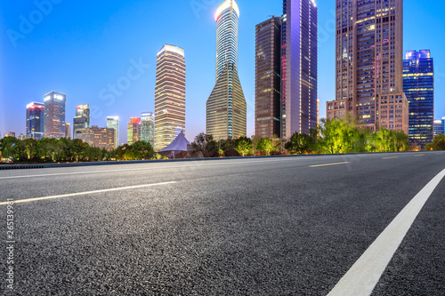 Shanghai modern commercial office buildings and empty asphalt road at night © ABCDstock