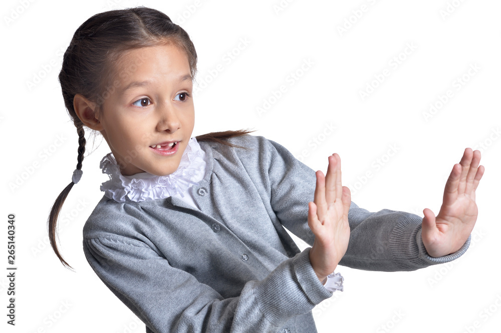 Portrait of cute little girl posing on white background