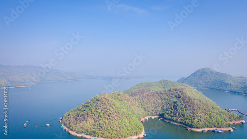 Island scenery and beautiful water with blue sky and morning fog at Srinakarin Dam, Kanchanaburi, Thailand Wonderful scenes of nature in the morning