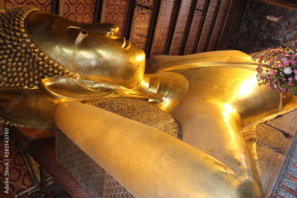great statue of buddha in a buddhist temple (wat pho) in bangkok (thailand) 