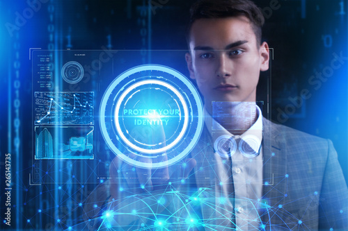 The concept of business, technology, the Internet and the network. A young entrepreneur working on a virtual screen of the future and sees the inscription: Protect your identity