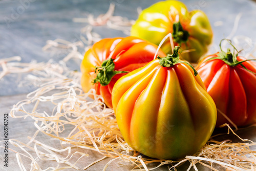 Oxheart tomato is a large beefsteak type tomato. photo