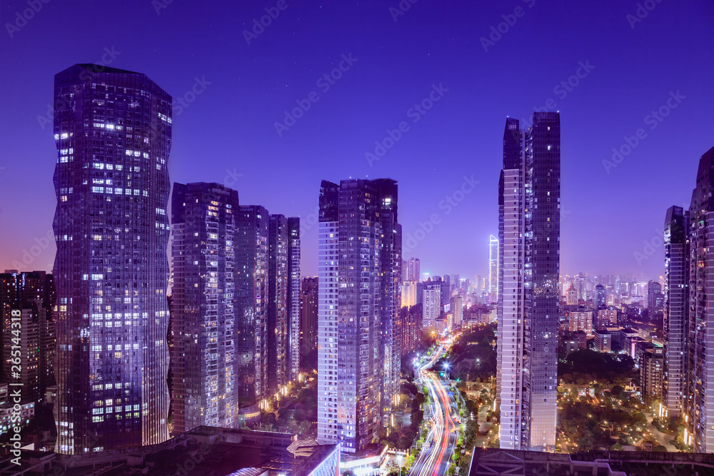 Cityscape with hectic traffic and skyscrapers at dusk,view in the business district.Fuzhou,Fujian,China