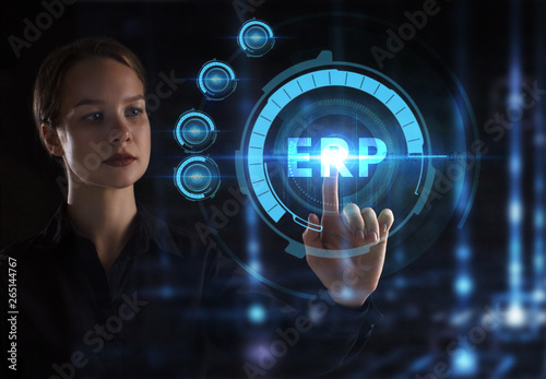 The concept of business, technology, the Internet and the network. A young entrepreneur working on a virtual screen of the future and sees the inscription: ERP © Egor
