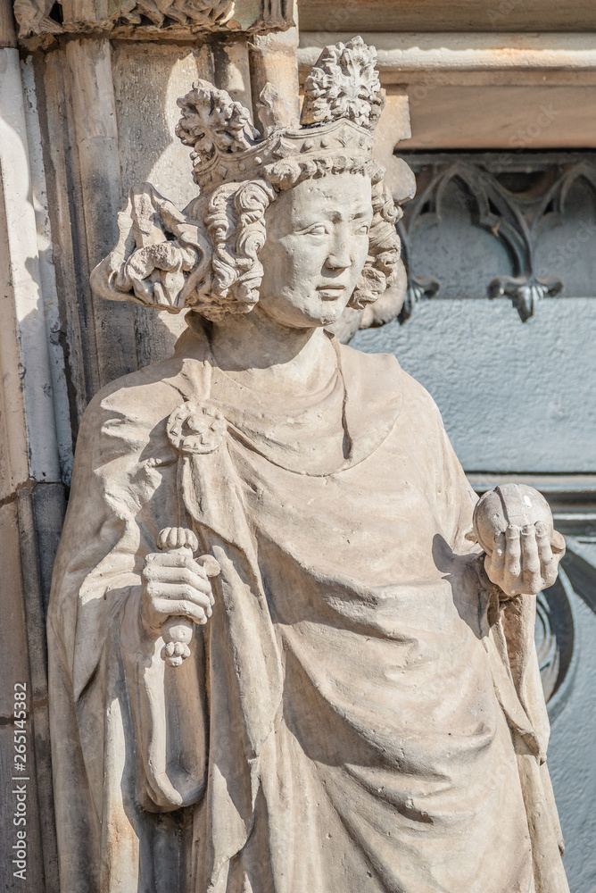 Fototapeta premium Wall figure of queen at main facade of cathedral in Magdeburg, Germany