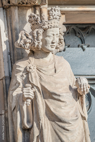 Wall figure of queen at main facade of cathedral in Magdeburg, Germany