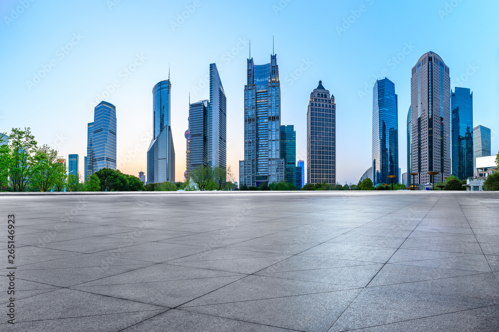 Shanghai modern commercial office buildings and square floor at dusk