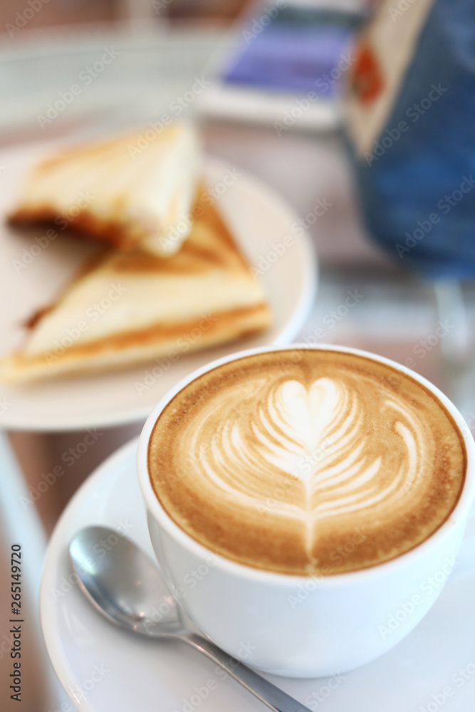 hot latte coffee drink and sandwich put on table breakfast in the morning day