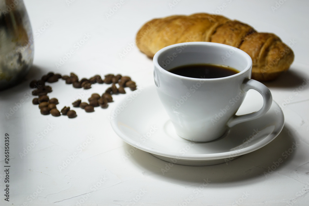 Coffee cup croissant and heart of coffee bean Coffee cup croissant and heart of coffee bean
