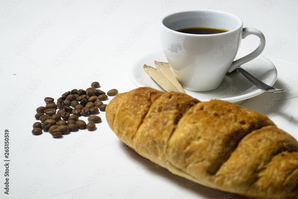 Coffee and fresh croissant on wooden background Coffee and fresh croissant on wooden background