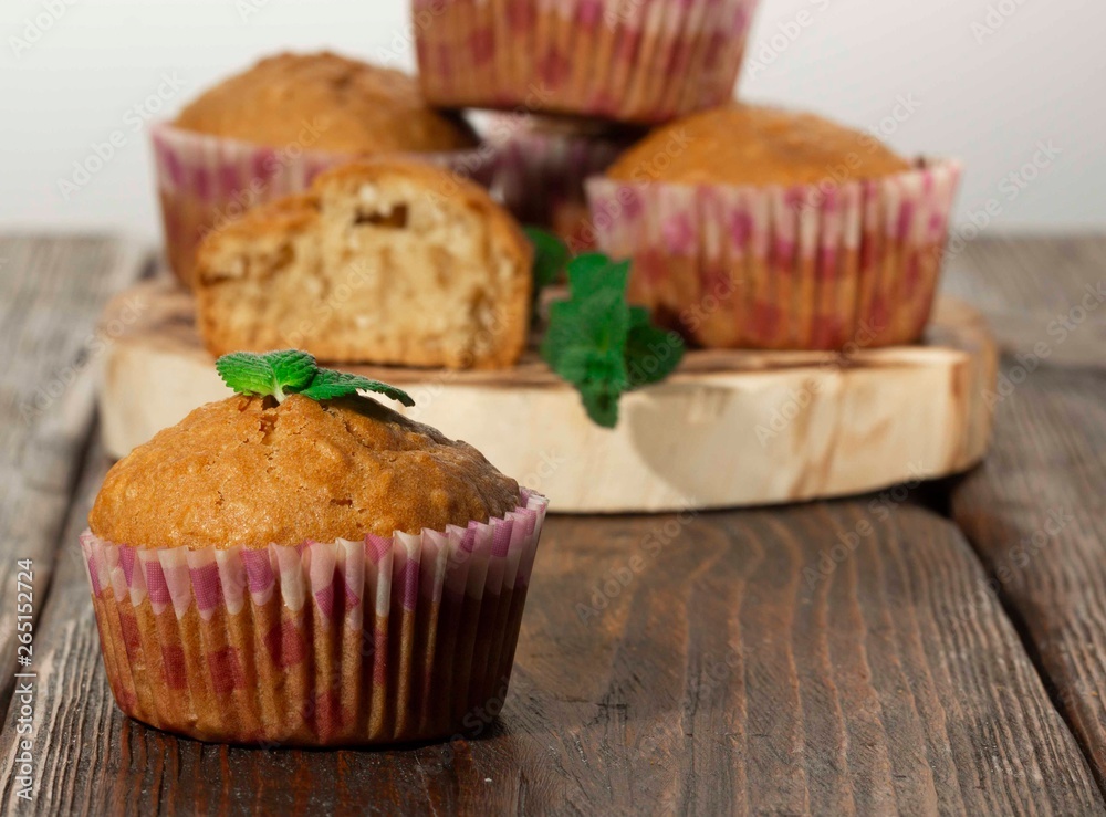 Vanilla cupcake, homemade pastry on wooden background Vanilla cupcake, homemade pastry on wooden background