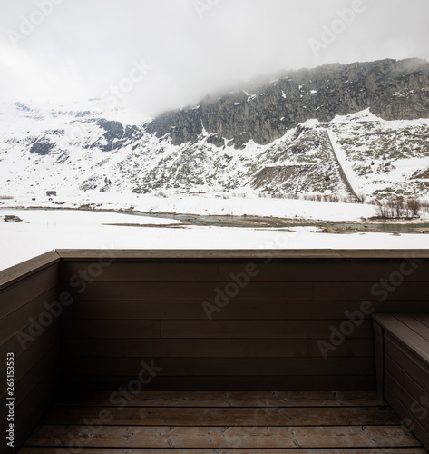 Wooden terrace terrace on a snowy mountain