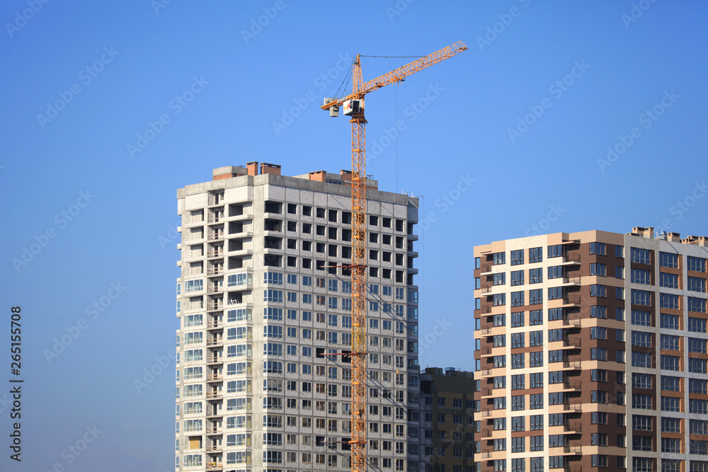 Kiev, Ukraine - February 17, 2019: The construction of a new monolithic multi-storey buildings. Unfinished building сonstruction. Construction site with crane. Modern apartment buildings